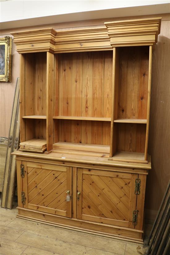 A pine inverse breakfront library bookcase W.160cm